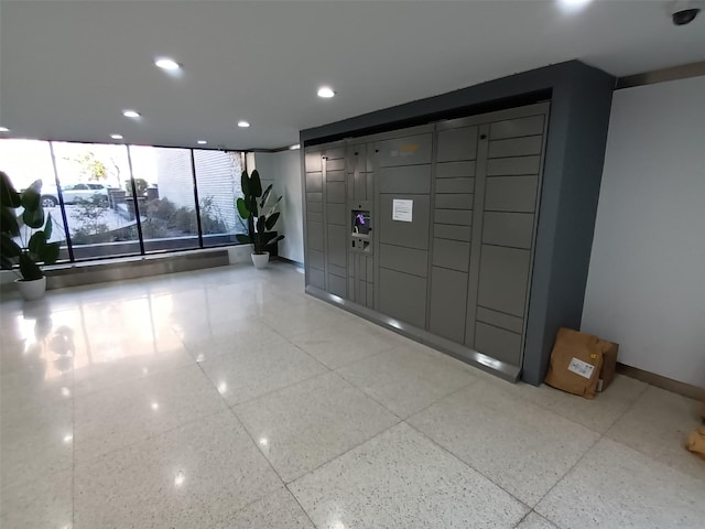 common area with recessed lighting and a surveillance system