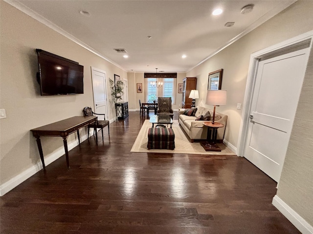 living room featuring ornamental molding, hardwood / wood-style flooring, baseboards, recessed lighting, and a chandelier