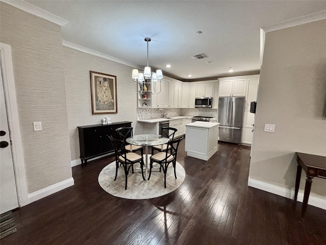 dining space with dark wood-style flooring, a chandelier, baseboards, ornamental molding, and recessed lighting