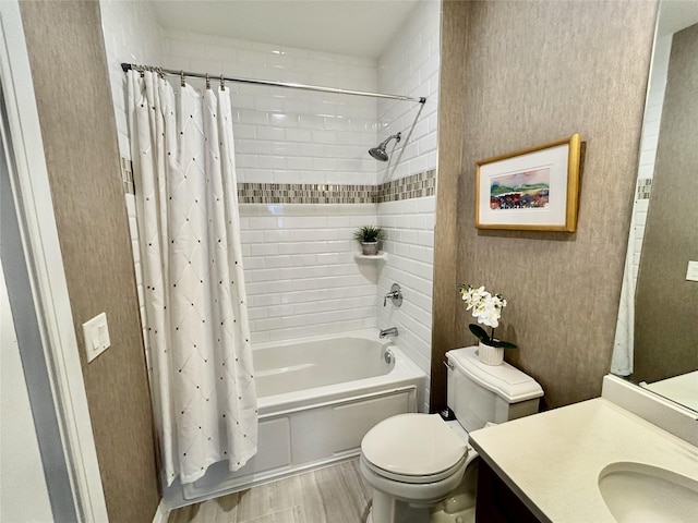 full bathroom with shower / bath combo with shower curtain, wood finished floors, toilet, and vanity