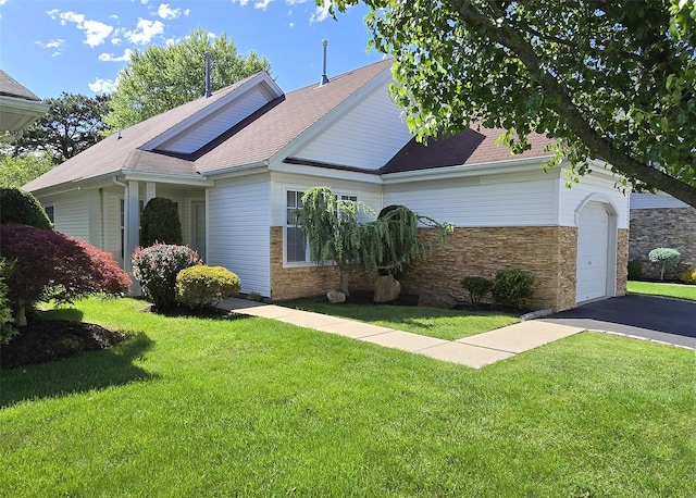 29 Madison Cir, Middle Island, NY 11953 - view of front of house featuring a front yard, an attached garage, asphalt driveway, and roof with shingles