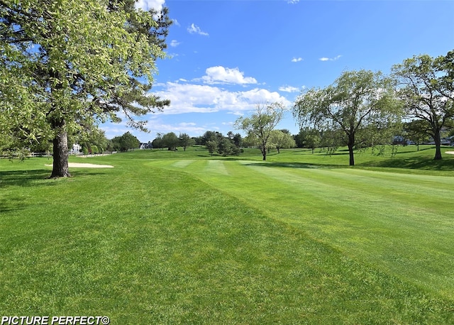 29 Madison Cir, Middle Island, NY 11953 - view of community with a lawn and view of golf course