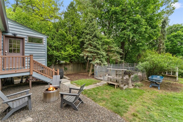 view of yard with an outdoor fire pit