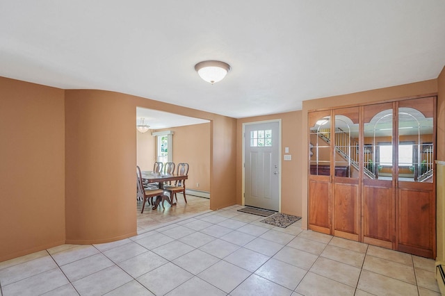 23 John St, Port Jefferson Station, NY 11776 - foyer entrance with light tile patterned floors and baseboard heating