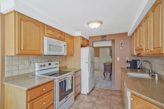 23 John St, Port Jefferson Station, NY 11776 - kitchen with white appliances, a sink, light tile patterned flooring, tasteful backsplash, and light stone countertops