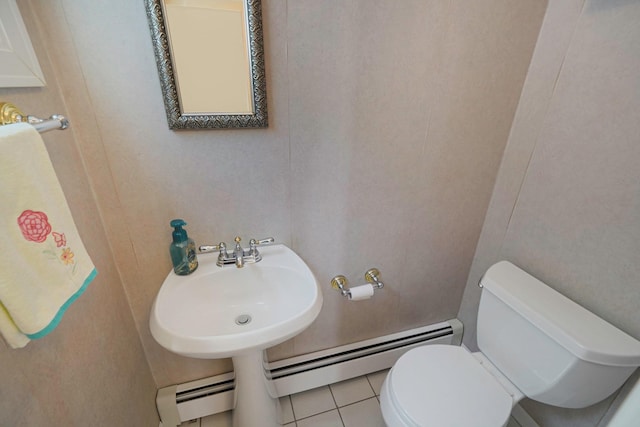 23 John St, Port Jefferson Station, NY 11776 - half bathroom featuring a baseboard radiator, toilet, and tile patterned floors
