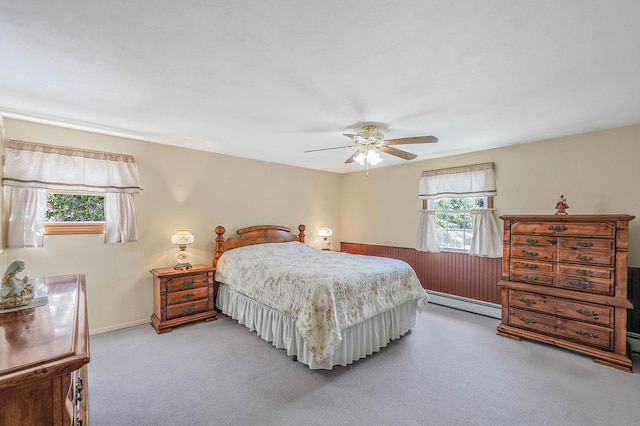 23 John St, Port Jefferson Station, NY 11776 - bedroom featuring a baseboard radiator, ceiling fan, carpet flooring, and baseboards