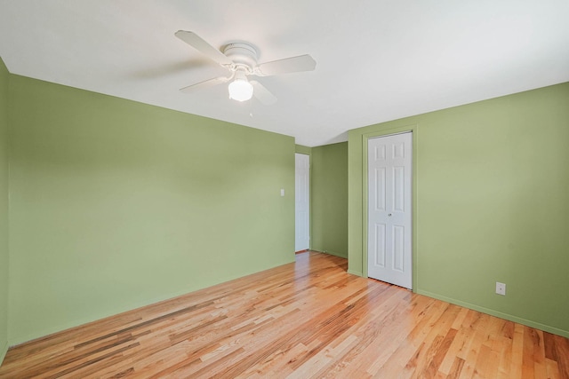 23 John St, Port Jefferson Station, NY 11776 - spare room featuring light wood-style flooring, ceiling fan, and baseboards
