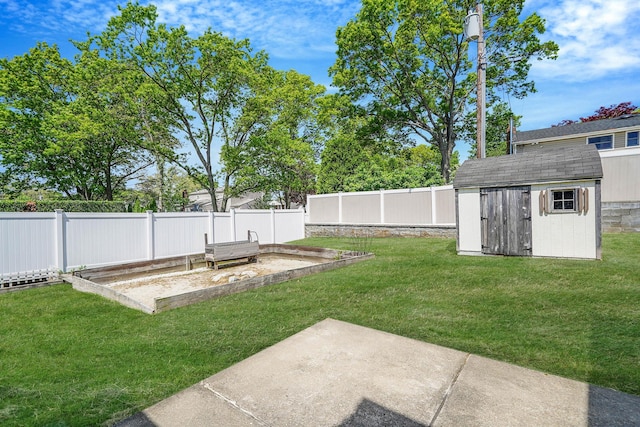 23 John St, Port Jefferson Station, NY 11776 - view of yard featuring a shed, an outdoor structure, a garden, and a patio area