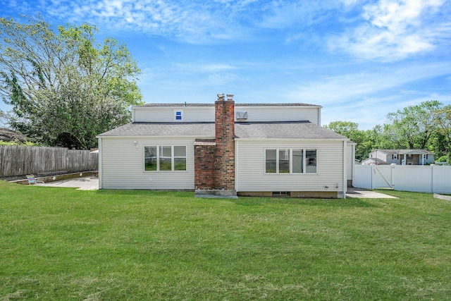 23 John St, Port Jefferson Station, NY 11776 - back of property featuring a chimney, a patio area, and a shingled roof