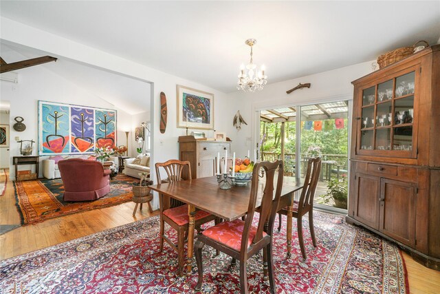 10 S Mountain Pond, Garrison, NY 10524 - dining room with light wood finished floors, a chandelier, and lofted ceiling
