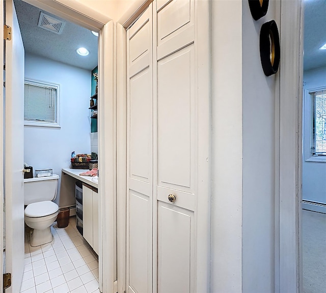 5 Water Lilly Ln, Monticello, NY 12701 - bathroom featuring toilet, tile patterned floors, vanity, and recessed lighting