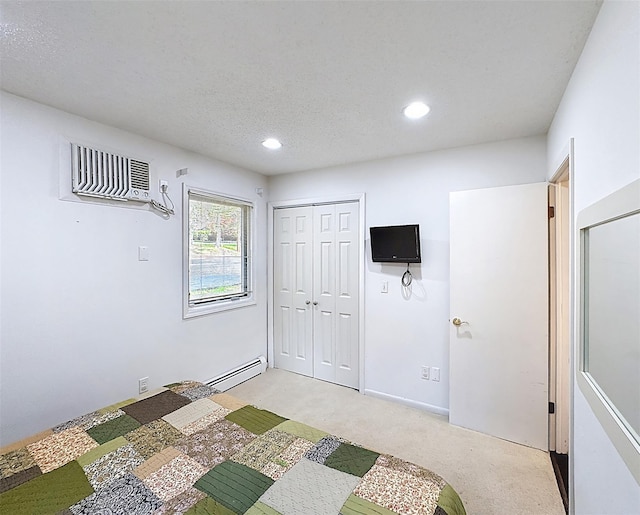 5 Water Lilly Ln, Monticello, NY 12701 - bedroom featuring a wall mounted air conditioner, light colored carpet, recessed lighting, a baseboard heating unit, and a closet