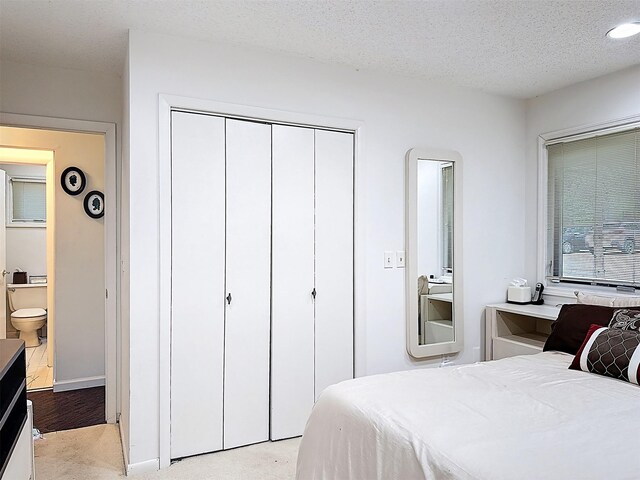 5 Water Lilly Ln, Monticello, NY 12701 - bedroom with a closet, a textured ceiling, and light colored carpet