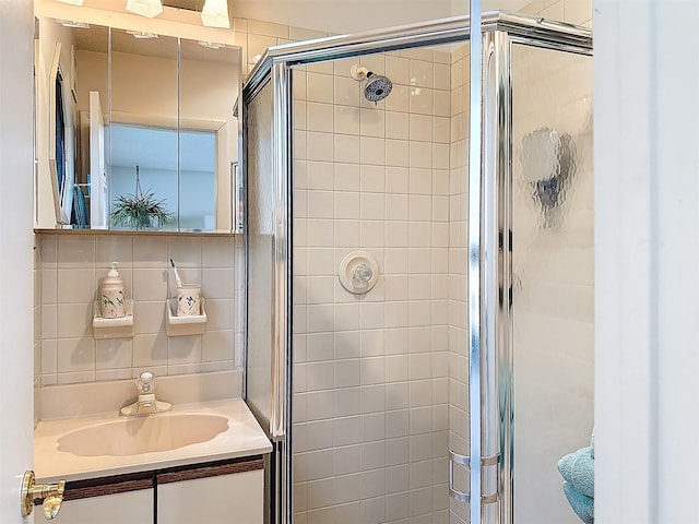 5 Water Lilly Ln, Monticello, NY 12701 - bathroom featuring a shower stall, tasteful backsplash, and vanity