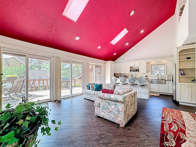 5 Water Lilly Ln, Monticello, NY 12701 - living area with recessed lighting, a skylight, dark wood finished floors, and high vaulted ceiling