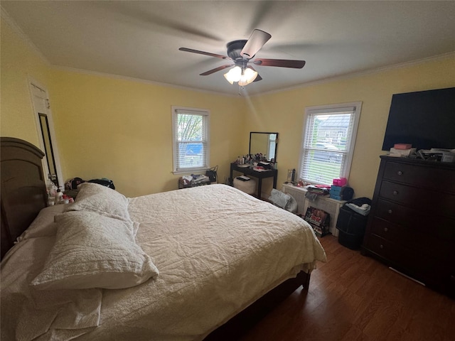 702 Tower Ct, Uniondale, NY 11553 - bedroom with wood finished floors, ornamental molding, multiple windows, and a ceiling fan
