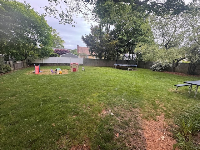 702 Tower Ct, Uniondale, NY 11553 - view of yard featuring a trampoline