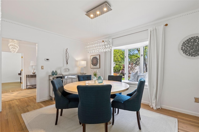 2 Robert Crisfield Pl, Rye, NY 10580 - dining space featuring a chandelier, light wood-style flooring, and baseboards