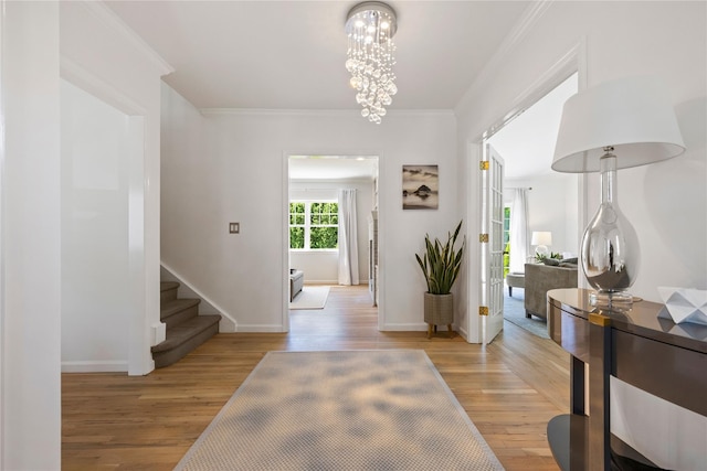 2 Robert Crisfield Pl, Rye, NY 10580 - foyer with a chandelier, light wood-type flooring, ornamental molding, baseboards, and stairway