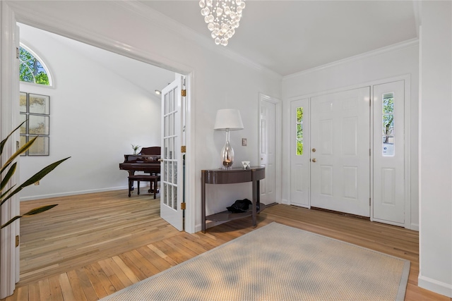 2 Robert Crisfield Pl, Rye, NY 10580 - entryway featuring healthy amount of natural light, light wood-type flooring, ornamental molding, and baseboards