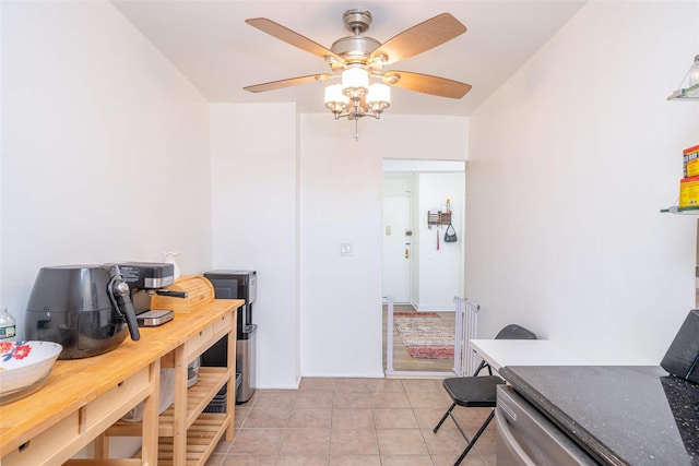 dining space featuring a ceiling fan and light tile patterned floors