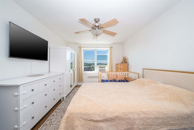 bedroom with dark wood-type flooring and ceiling fan