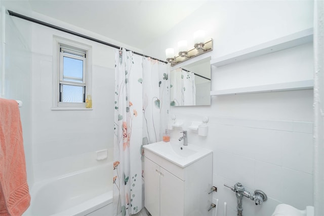 bathroom featuring vanity and shower / tub combo with curtain