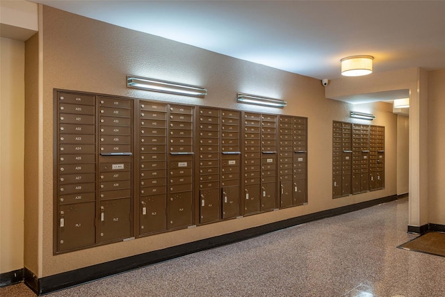 view of home's community featuring mail area