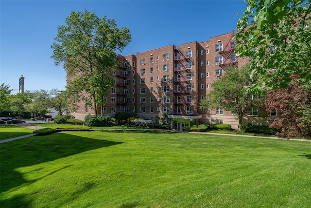 view of property's community with a yard