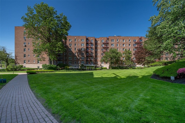 view of home's community featuring a yard