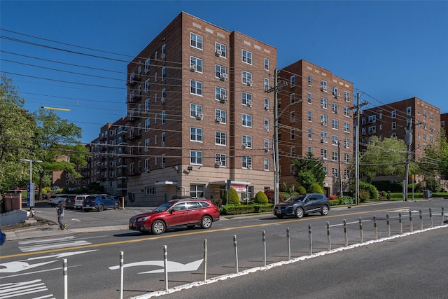 view of apartment building / complex with fence