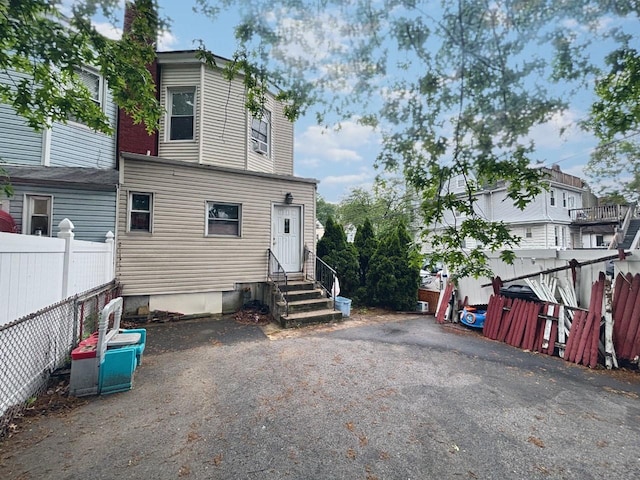 556 Van Cortlandt Park Ave, Yonkers, NY 10705 - back of house with entry steps and fence