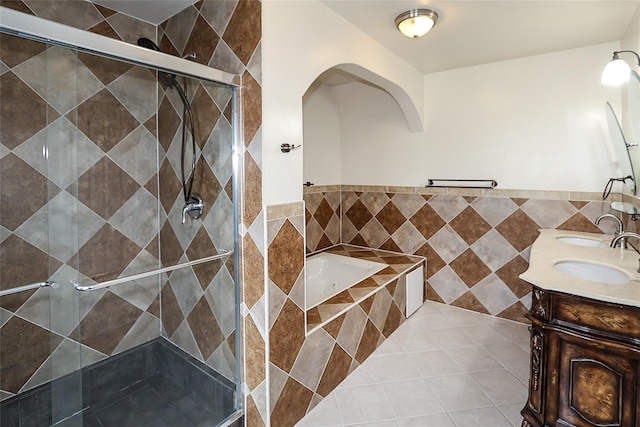 114 Frankel Blvd, Merrick, NY 11566 - full bath featuring a garden tub, double vanity, a stall shower, and tile patterned flooring