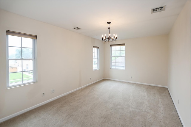 114 Frankel Blvd, Merrick, NY 11566 - empty room featuring a chandelier, light carpet, and baseboards