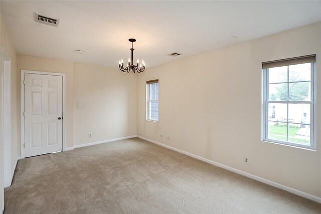 114 Frankel Blvd, Merrick, NY 11566 - empty room featuring light carpet, a chandelier, and baseboards