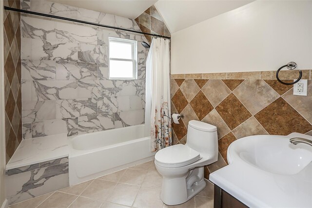 114 Frankel Blvd, Merrick, NY 11566 - bathroom with tile walls, shower / bath combo with shower curtain, toilet, lofted ceiling, and vanity