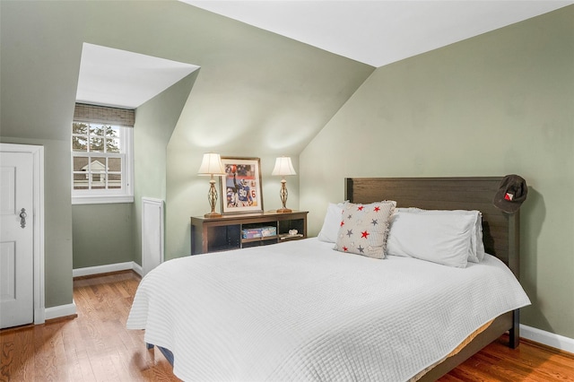 17 Byron Ln, Larchmont, NY 10538 - bedroom featuring baseboards, wood finished floors, and vaulted ceiling