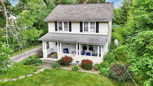 8 Townsend Blvd, Poughkeepsie, NY 12603 - view of front of property with a porch, a shingled roof, a front lawn, and a chimney
