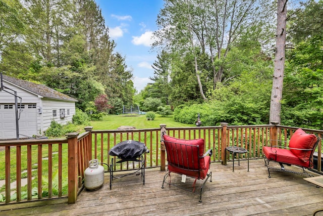 8 Townsend Blvd, Poughkeepsie, NY 12603 - deck featuring an outdoor structure, a yard, a trampoline, area for grilling, and view of wooded area