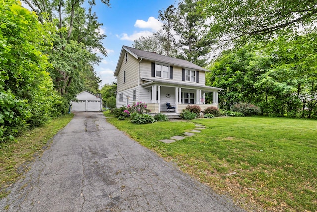 8 Townsend Blvd, Poughkeepsie, NY 12603 - view of front facade with an outdoor structure, a detached garage, a front lawn, and covered porch