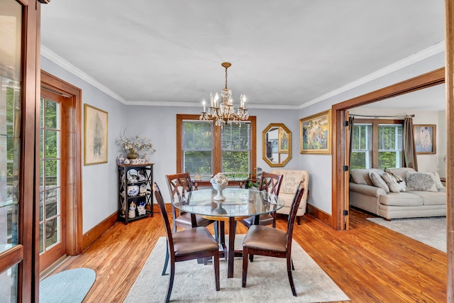 8 Townsend Blvd, Poughkeepsie, NY 12603 - dining room with a chandelier, light wood-style flooring, baseboards, and ornamental molding
