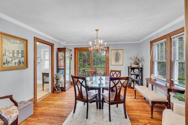 8 Townsend Blvd, Poughkeepsie, NY 12603 - dining area with a chandelier, light wood-style floors, ornamental molding, and baseboards