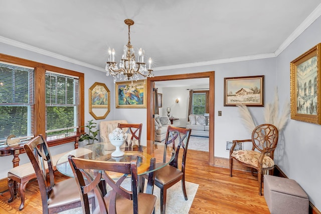 8 Townsend Blvd, Poughkeepsie, NY 12603 - dining room featuring light wood-style floors, a chandelier, crown molding, and baseboards
