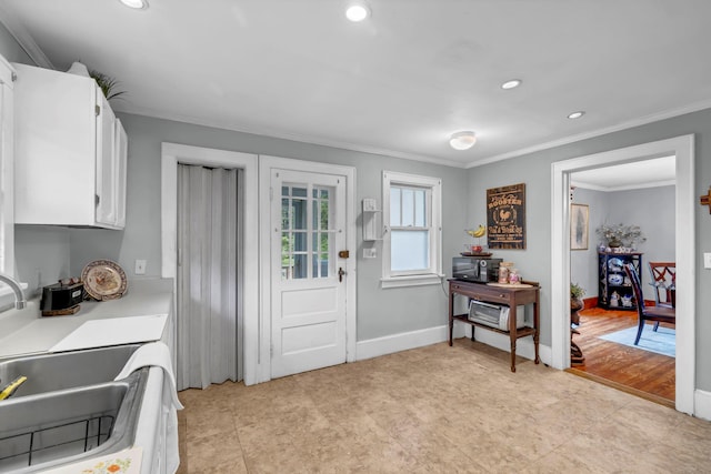 8 Townsend Blvd, Poughkeepsie, NY 12603 - kitchen with crown molding, white cabinets, recessed lighting, light countertops, and light tile patterned flooring