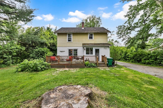 8 Townsend Blvd, Poughkeepsie, NY 12603 - rear view of property with a chimney, a deck, and a lawn