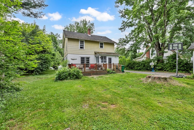 8 Townsend Blvd, Poughkeepsie, NY 12603 - rear view of house with a chimney, a wooden deck, and a yard