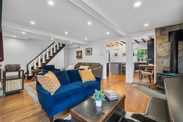 1219 Maple Ave, Peekskill, NY 10566 - living room with a wood stove, beam ceiling, stairway, light wood-style flooring, and recessed lighting