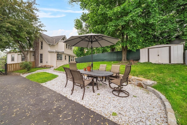 1219 Maple Ave, Peekskill, NY 10566 - view of patio with a shed, an outbuilding, and outdoor dining area