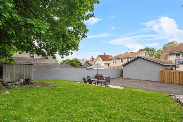 1219 Maple Ave, Peekskill, NY 10566 - view of yard featuring a patio, an outbuilding, and a shed